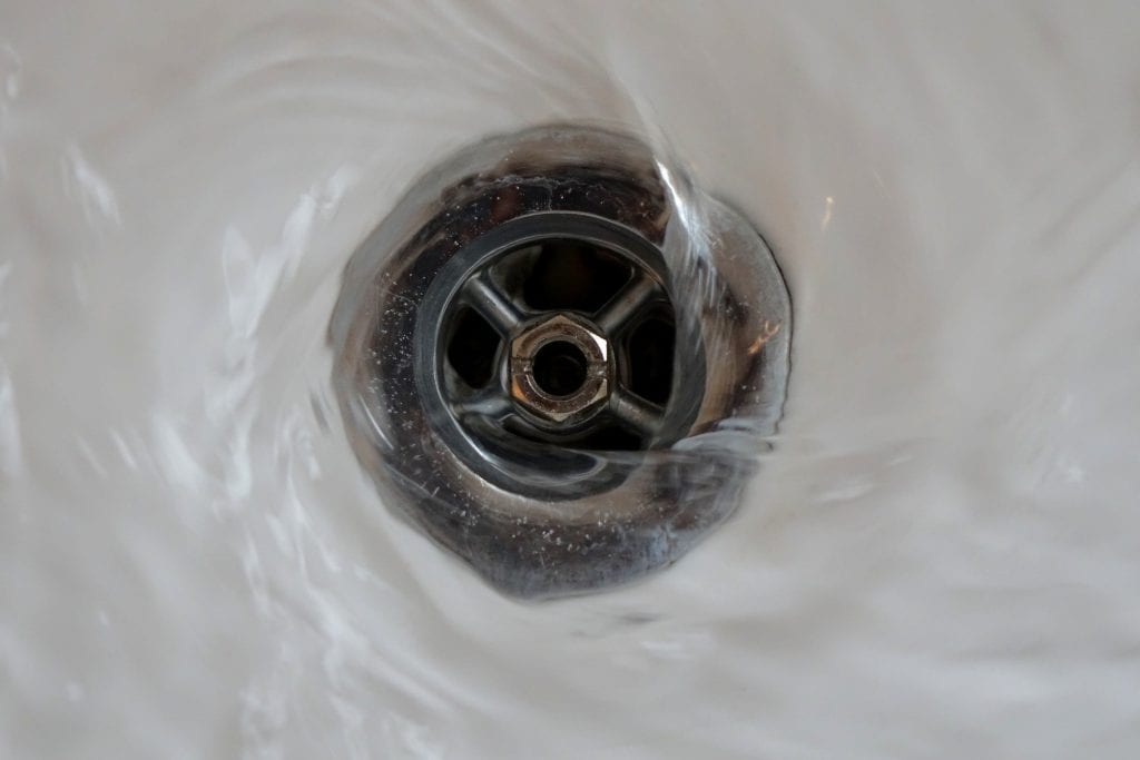 bathtub clog fixed by Northern Utah plumber